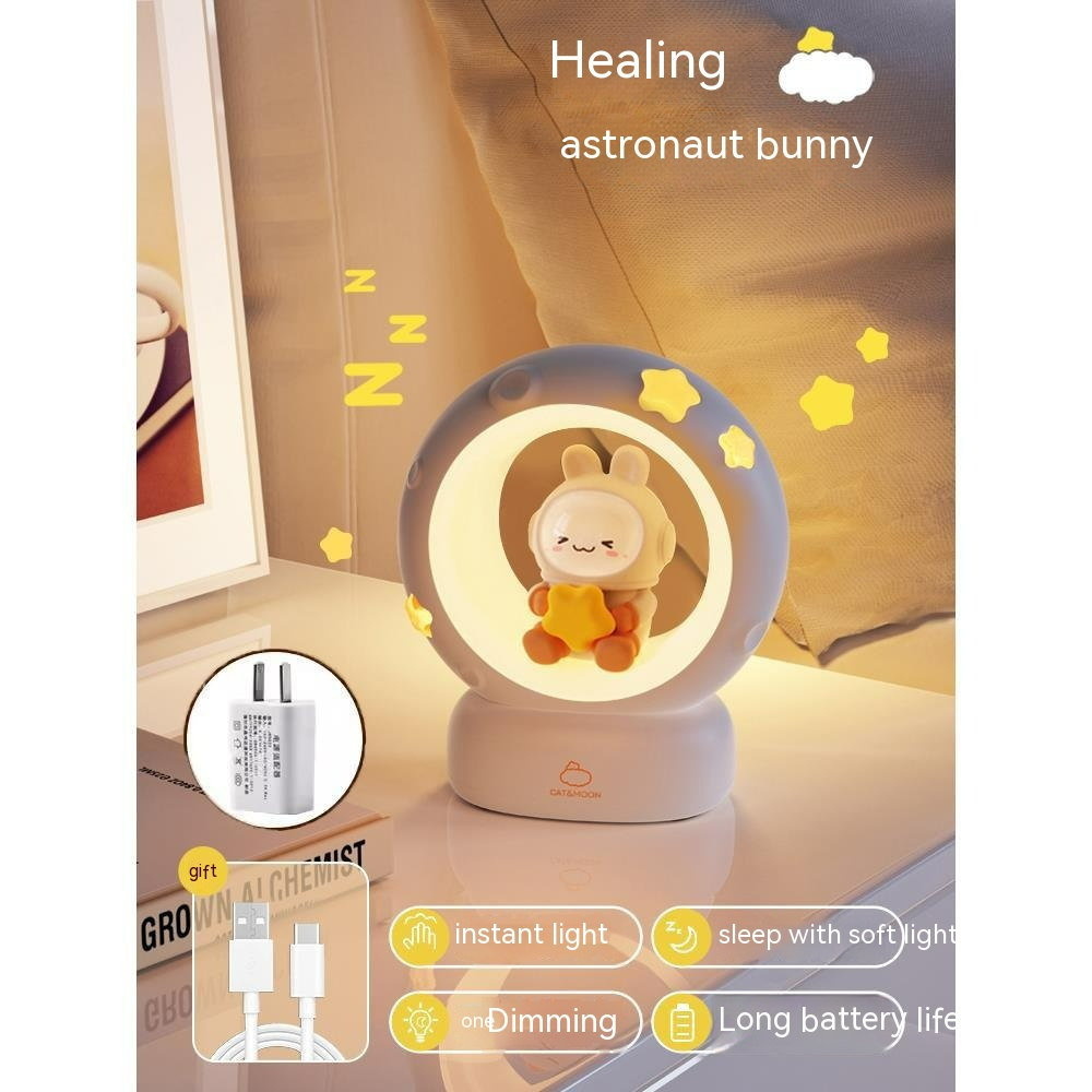 Gray night light lamp with warm ring glow and astronaut bunny character inside