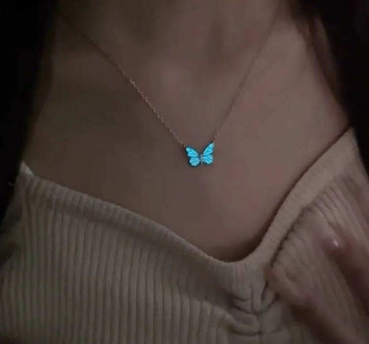 Butterfly pendant necklace with blue luminous butterfly charm on a chain
