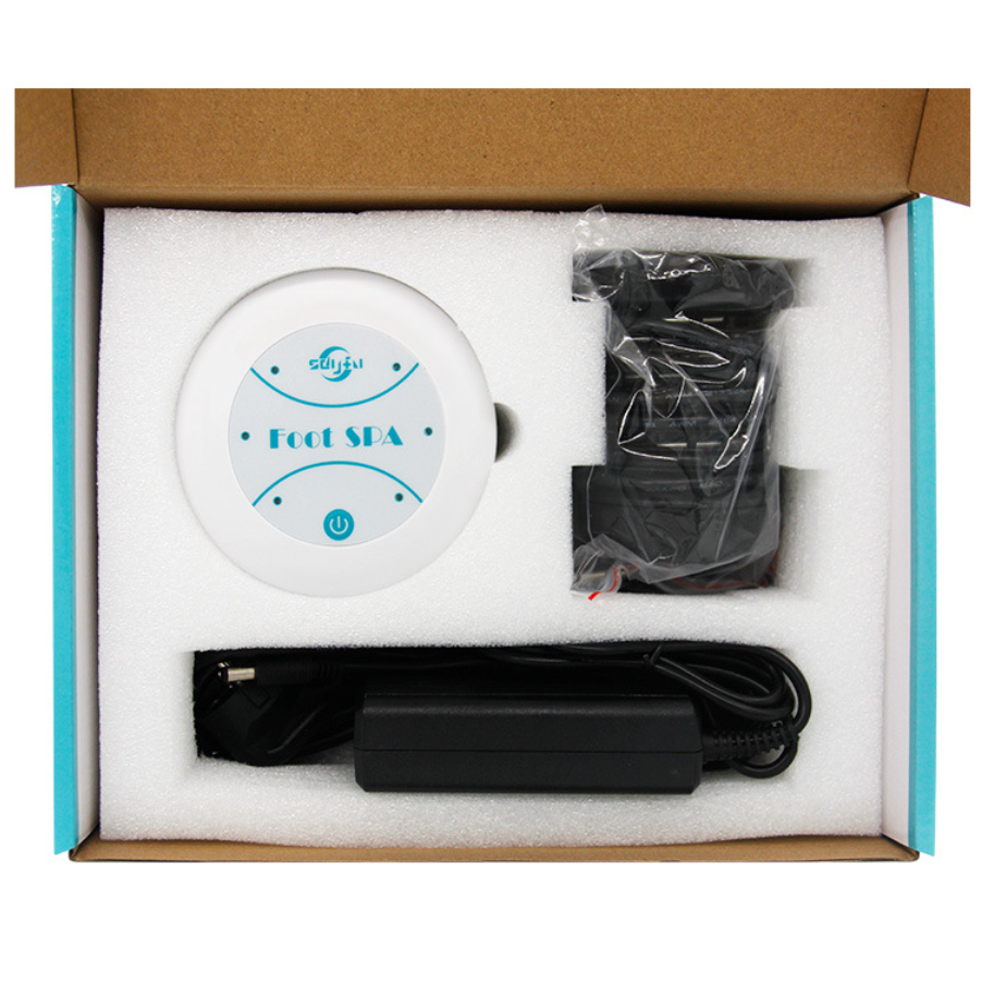 Portable foot spa control unit with cable and electrode pads, packed in a box