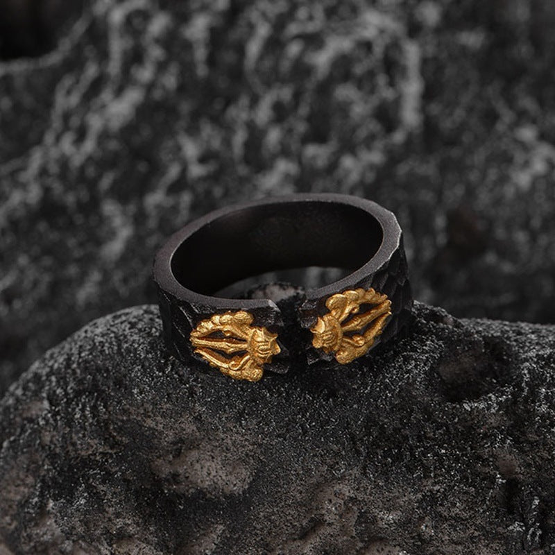 Black adjustable ring with two gold geometric medallion accents