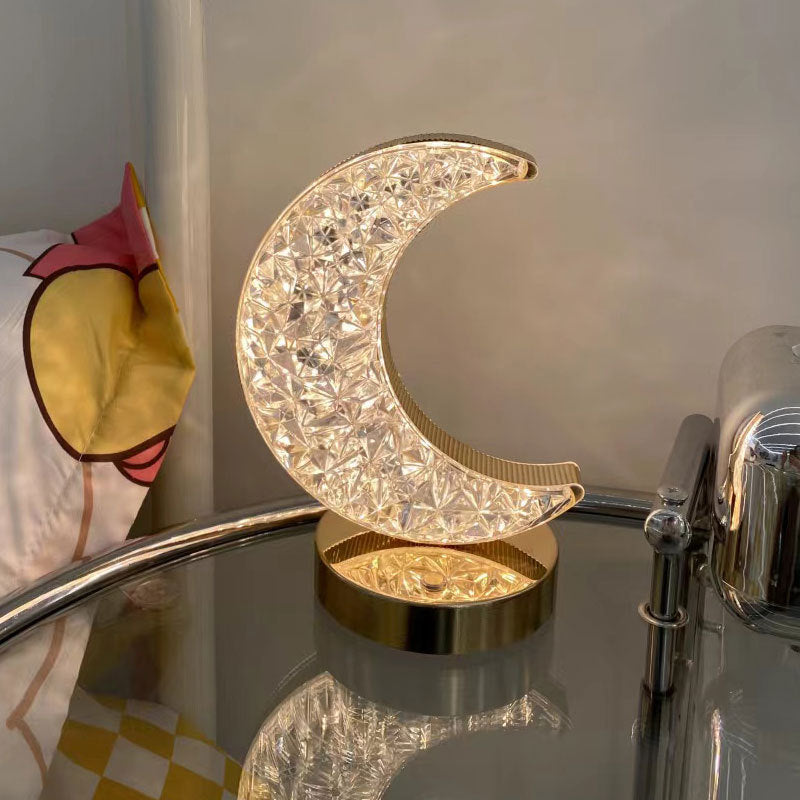 Crescent moon-shaped acrylic night lamp with crystal-like LED pattern on base