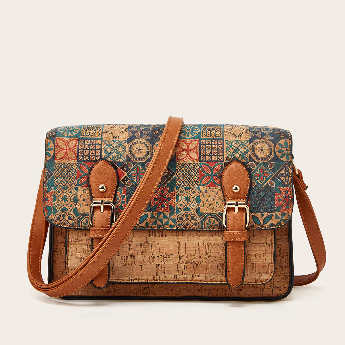 Women’s crossbody bag with teal tile-pattern flap and brown leather buckles