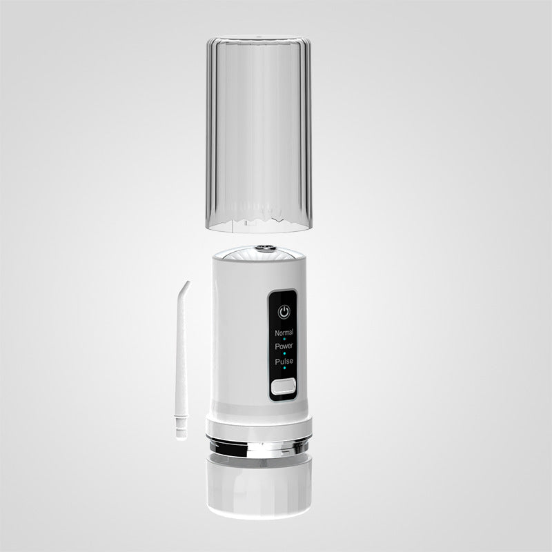 White compact water flosser base with transparent reservoir and attached nozzle wand