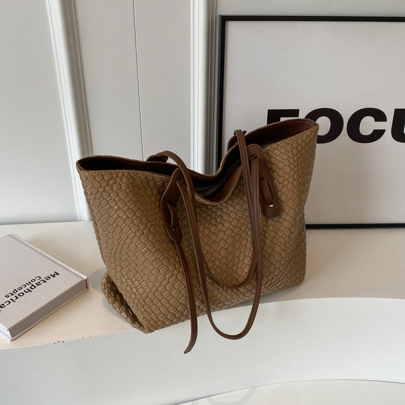 Woven PU shoulder tote bag in tan/beige with brown handles and long strap