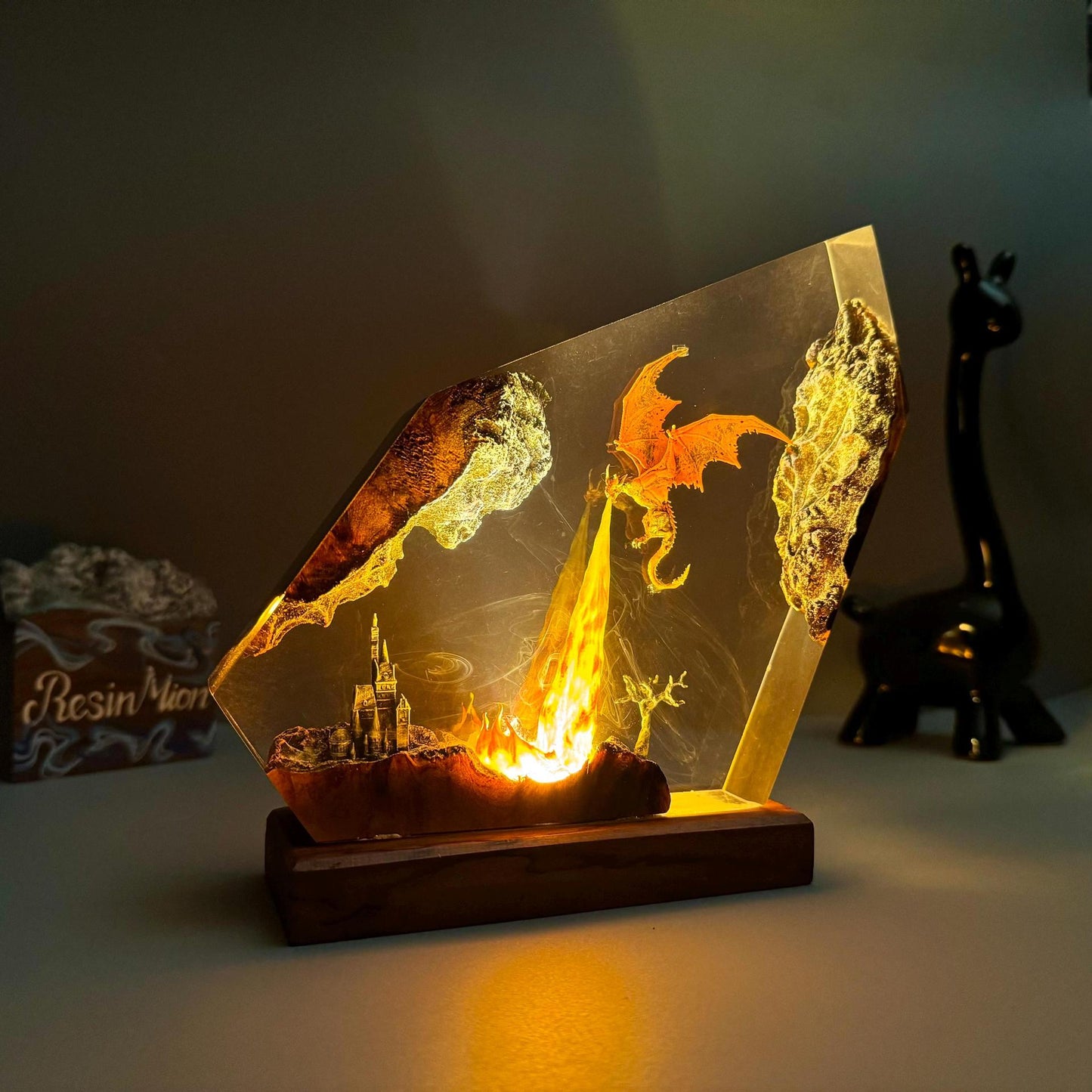 Fire dragon resin art lamp with warm orange glow, winged dragon resin details and wood base