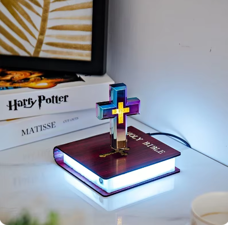 Floating LED cross ornament on square base with blue lighting and cable