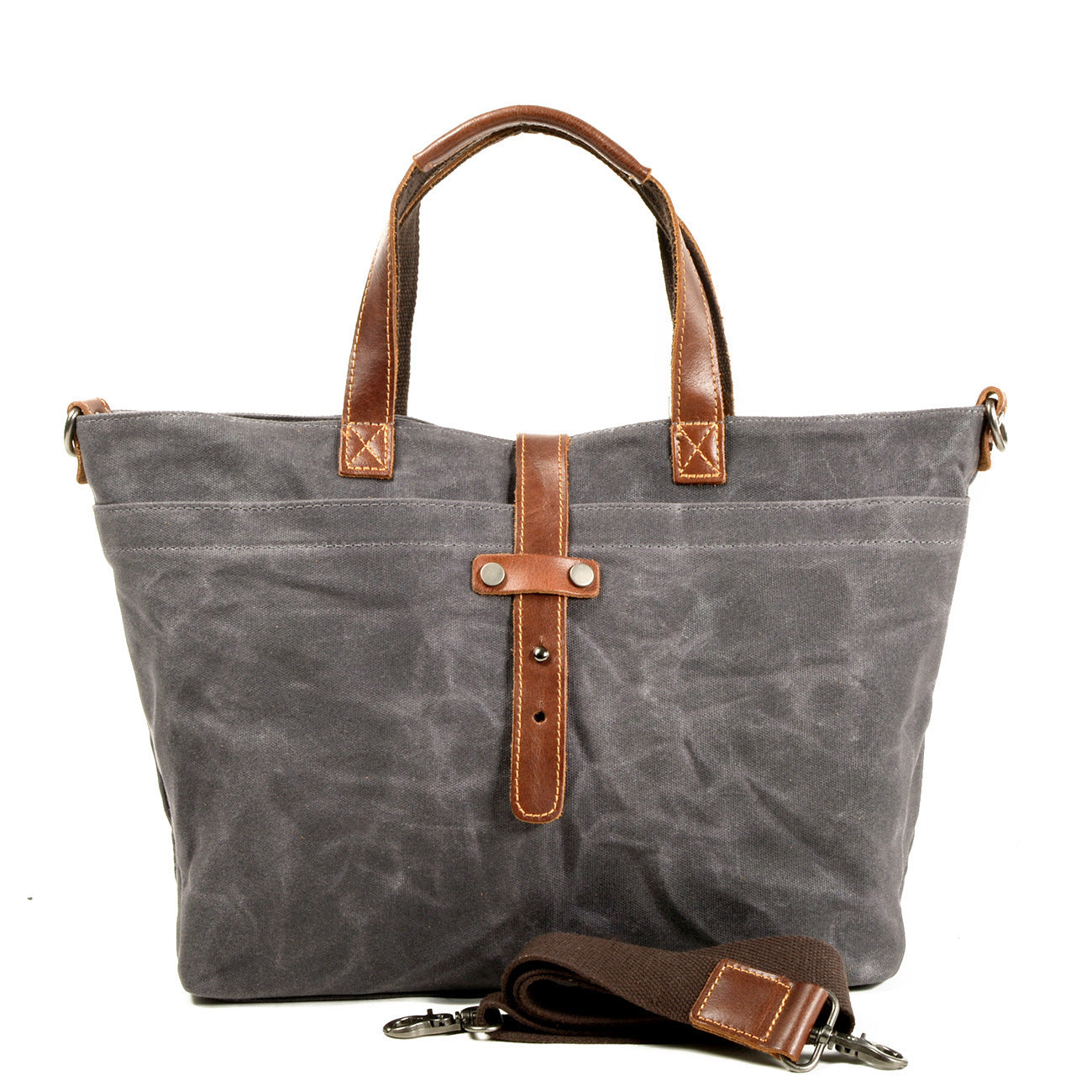 Large gray canvas tote bag with leather handles, front strap detail, and key fob