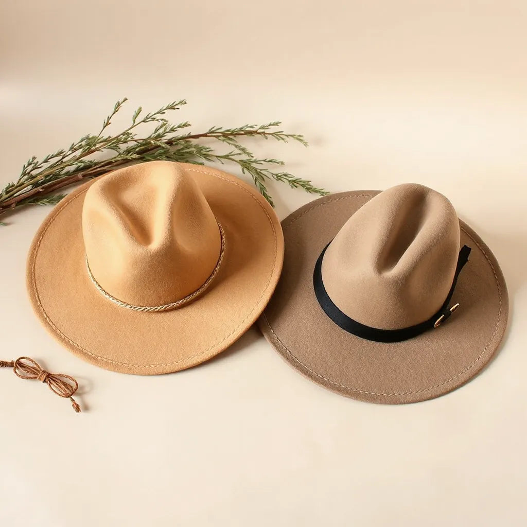 Two stylish cowboy and cowgirl hats with detailed felt texture and decorative bands