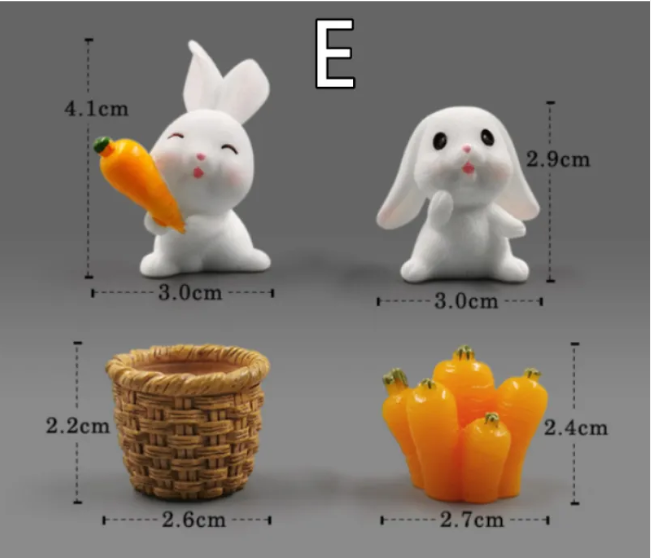 Mini resin rabbit and accessories set: carrot-holding bunny, white bunny, basket, orange cluster.