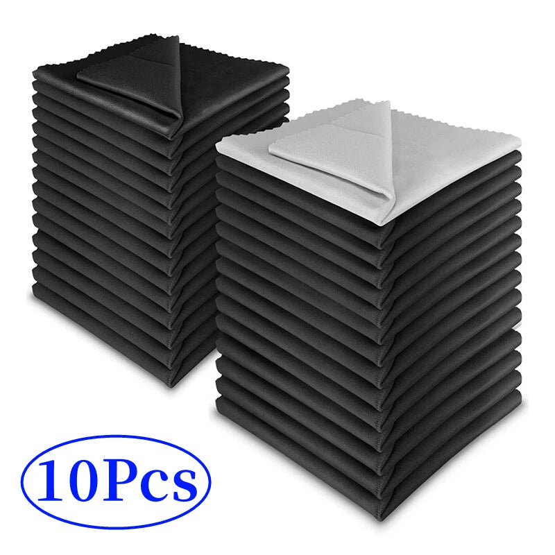 Microfiber cleaning cloths, stacked folded black square cloths