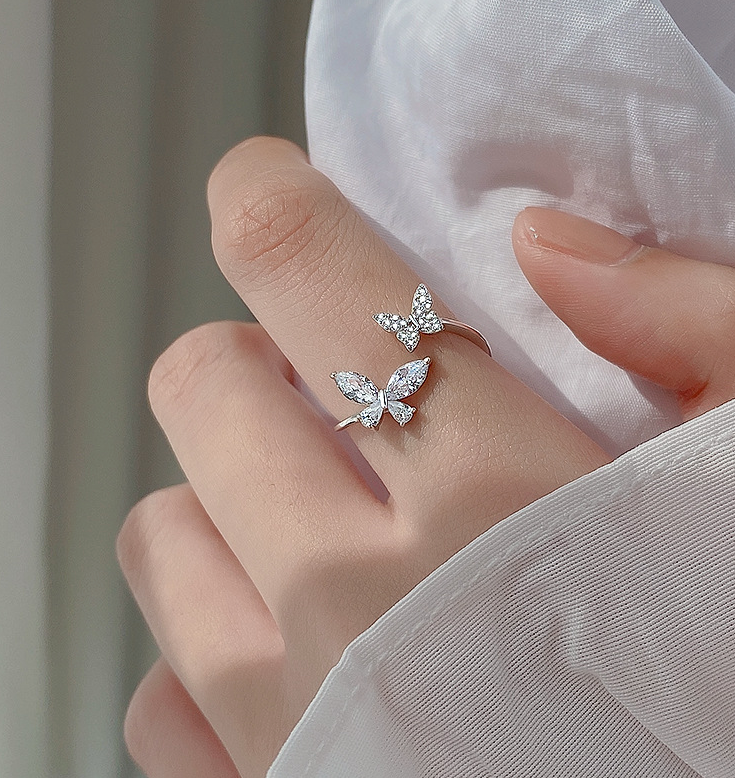 Sterling silver adjustable butterfly ring with pavé-style crystal stones on band