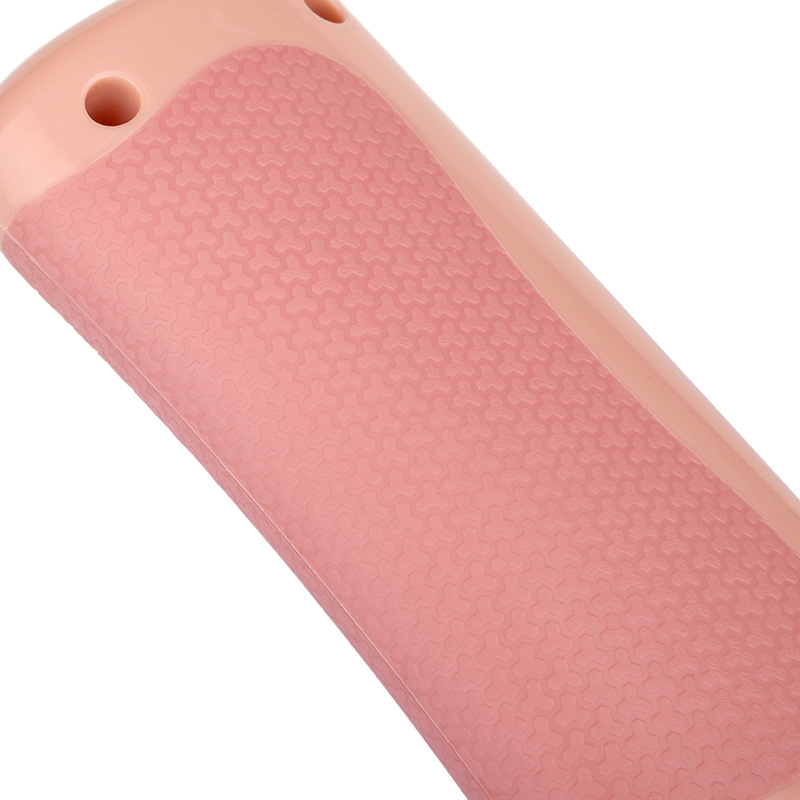 Pink pet grooming comb head with textured grip pad and oval handle openings