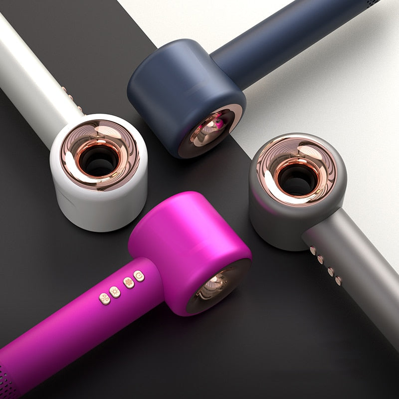 Navy and white hair dryer with pink attachment sleeves and rose-gold nozzle