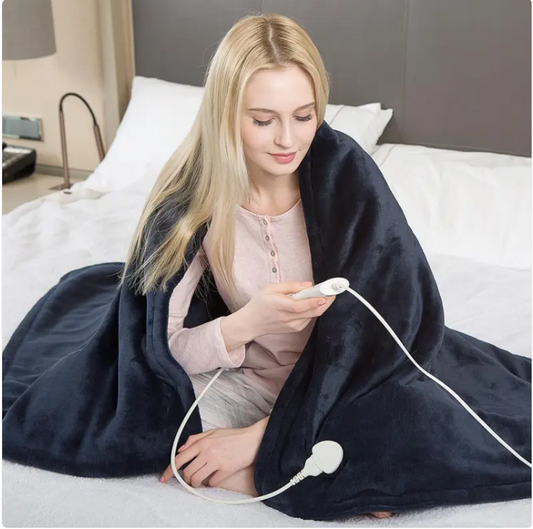 Navy electric heated flannel blanket with white controller and power cord, in use