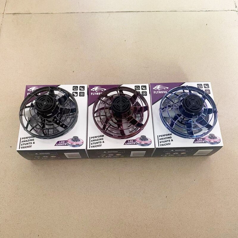 Three mini UFO spinner packages on floor, each showing LED options