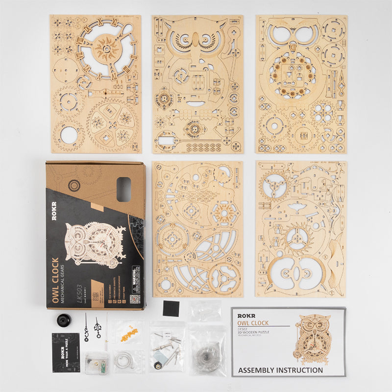 Wooden mechanical owl clock puzzle kit with laser-cut parts and instruction set