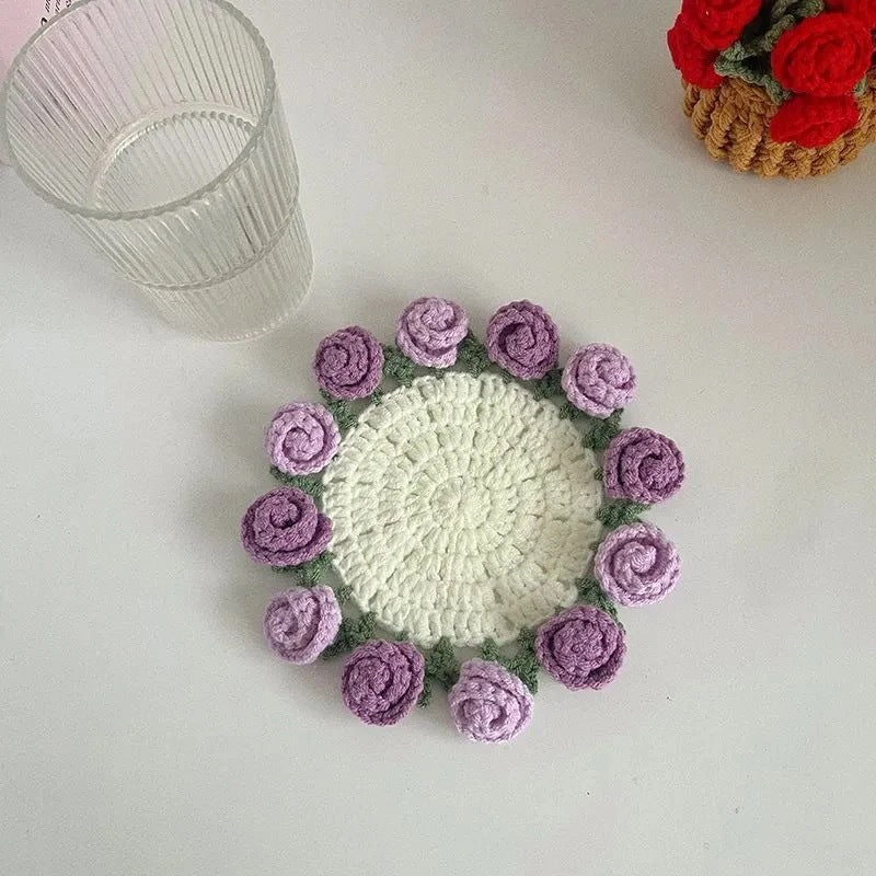 Crochet coaster with pale mint center and purple rose bud edging