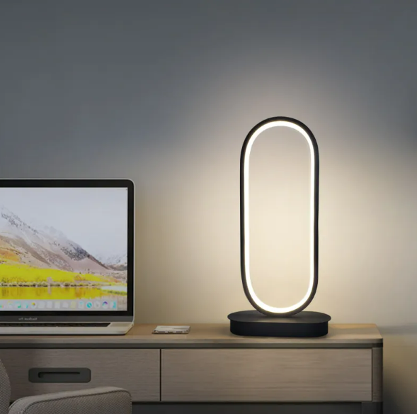 LED oval table lamp with warm glow, black frame and round base