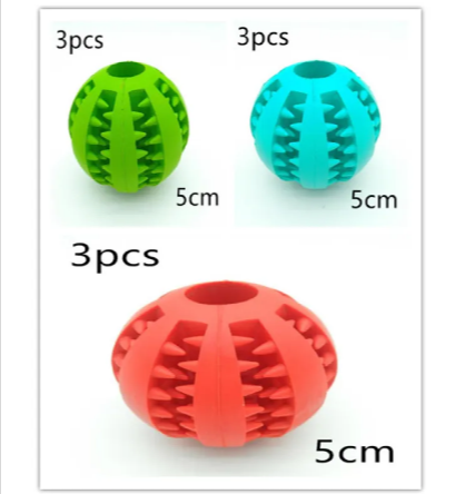 Set of three rubber puzzle dog balls showing sizes around 5 cm