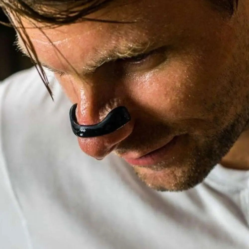 Close-up of a man wearing a black nasal dilator strip