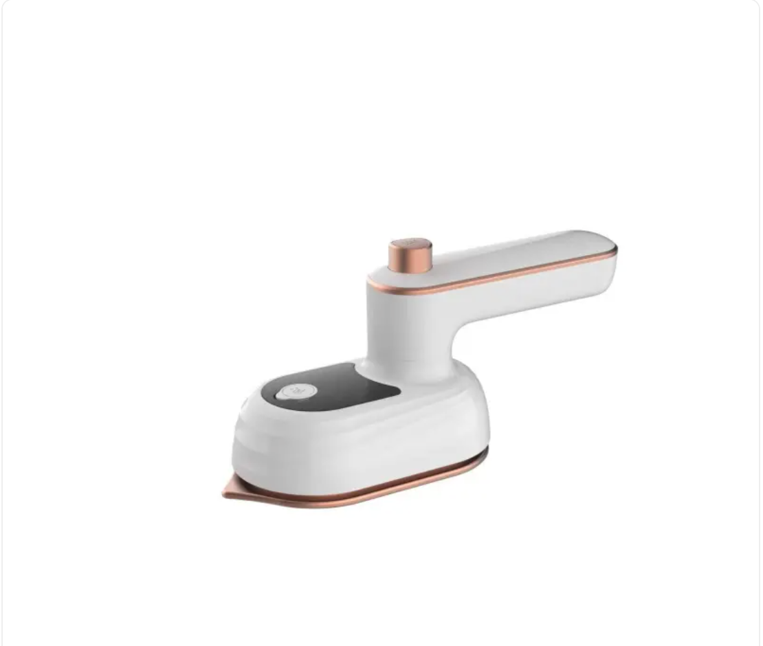 White mini steam iron three-quarter view with copper-trim soleplate