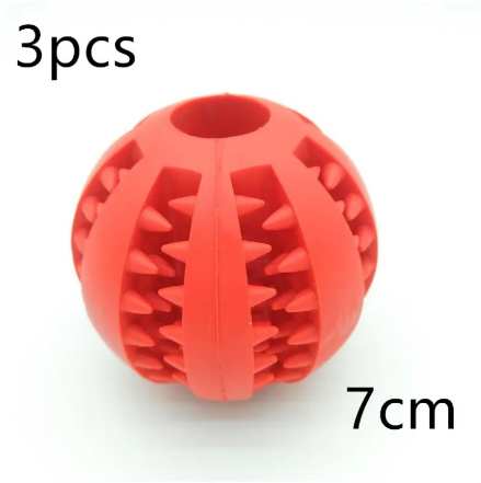Red rubber treat-dispensing slow feeder dog ball with circular base and spike ridges