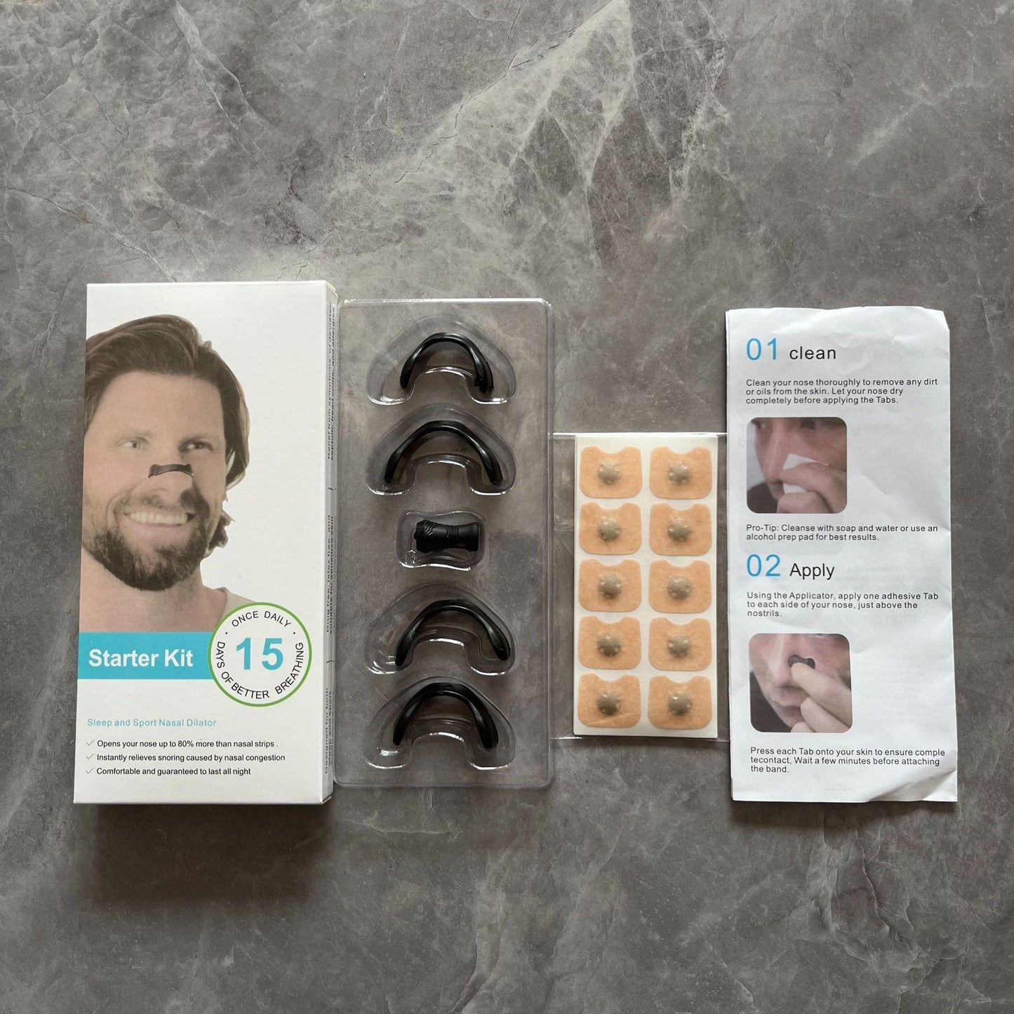 Nasal dilator kit in tray with black supports, patch sheets, and instructions