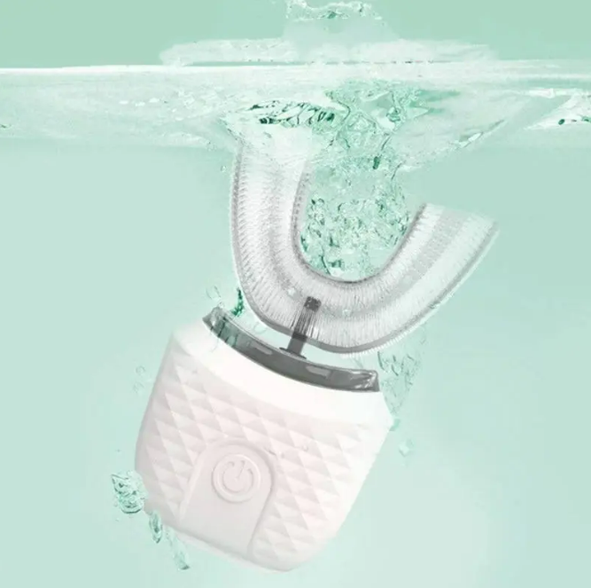 U-shaped ultrasonic toothbrush with white bristles and white body, splash droplets