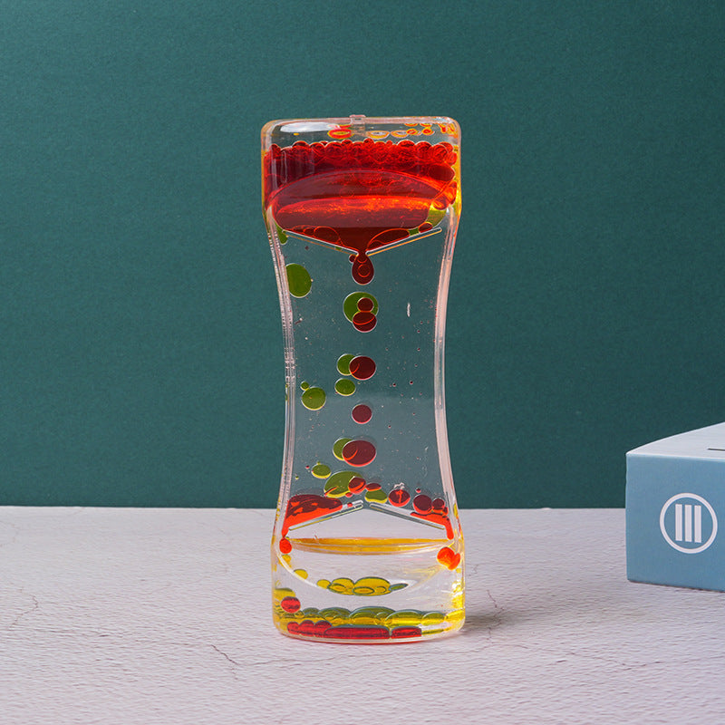 Two-color acrylic hourglass timer with red and yellow liquid in clear glass frame