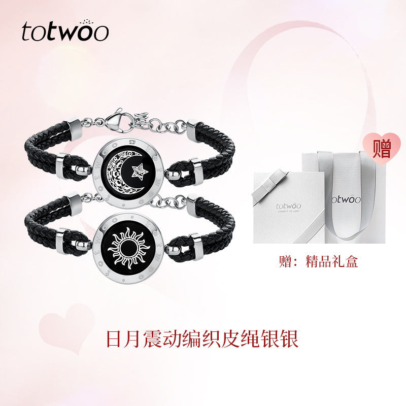Silver and black smart couple bracelets with round moon-and-star charm discs