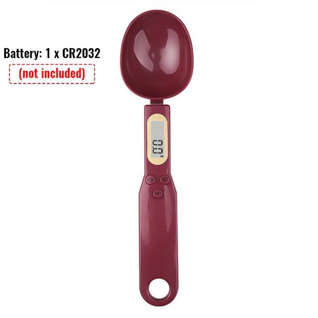 Dark red kitchen spoon scale with LCD display, control buttons, and oval cup