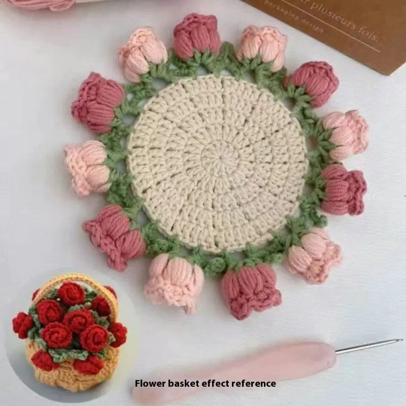 Crocheted coaster with cream center, pale green rim, and light pink rose-like crochet clusters