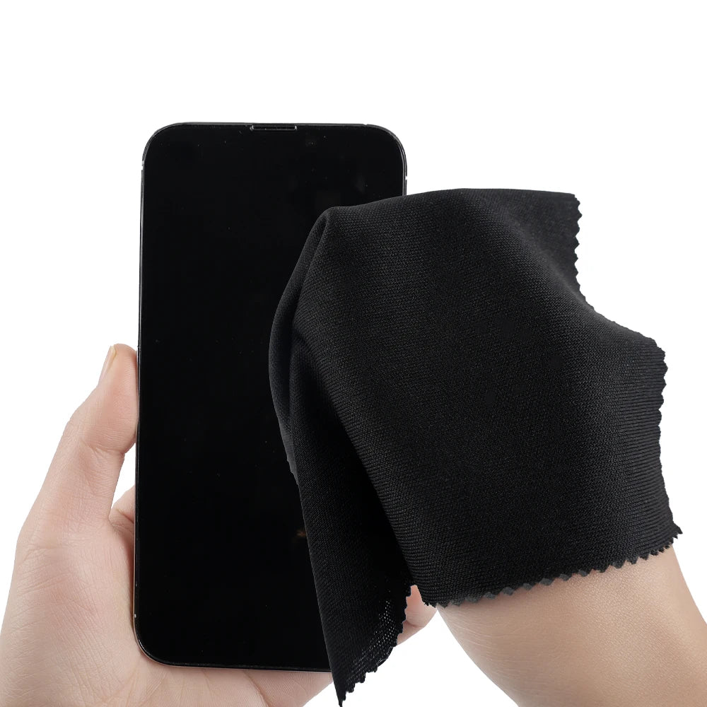 Microfiber cleaning cloth, black square cloth wiping a smartphone screen