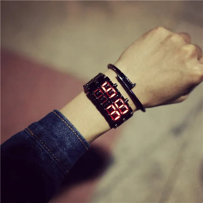 LED lava flow watch with red LED display on dark metal wrist band