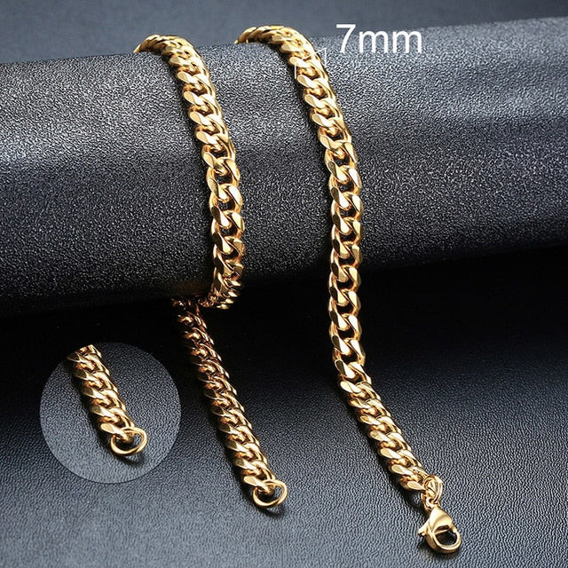 Gold-toned twisted rope Figaro necklace, 7mm chain links shown on wrist and neck sections