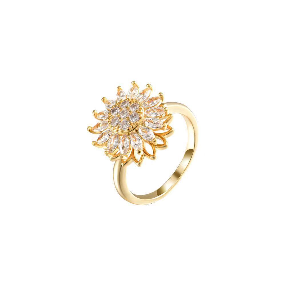 Gold sunflower fidget ring with crystal center and rotating petal spinner