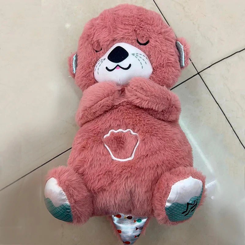 Soothing plush bear in rose pink with closed eyes and glowing heart patch on belly