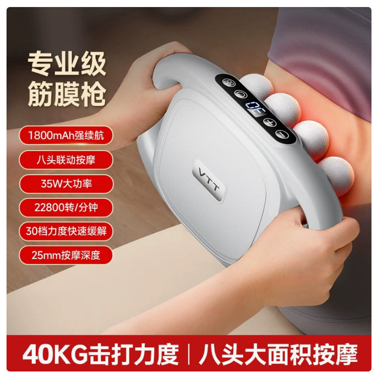 White massage gun with round head tips, shown held in a person’s hand