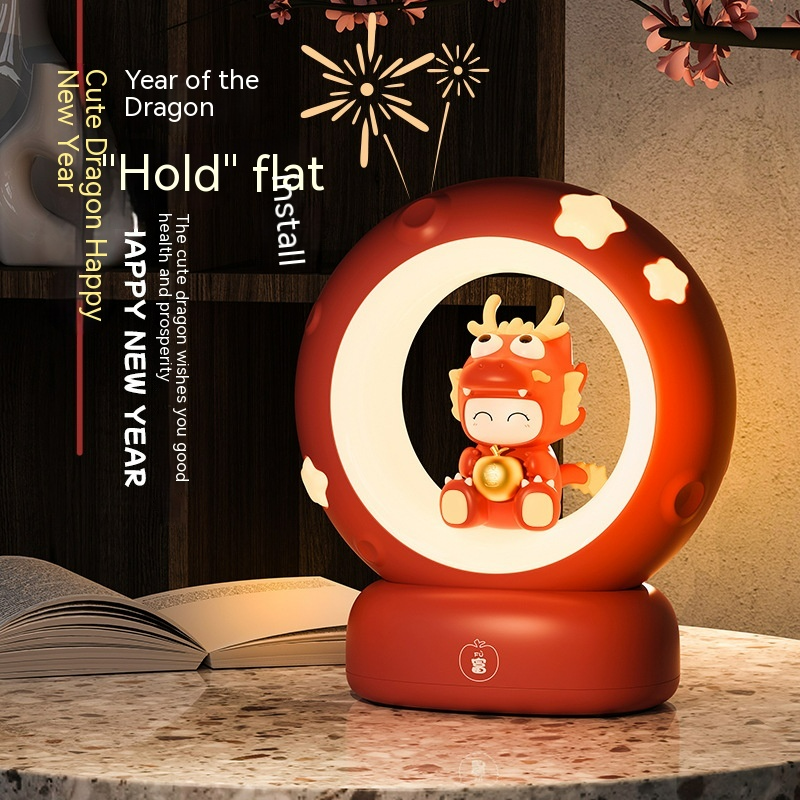 Red bedside night light with glowing ring and small dragon character inside
