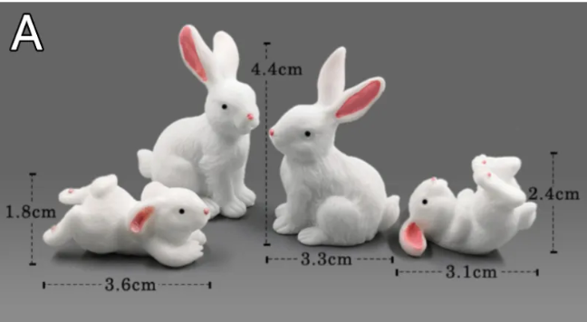 Mini white rabbit figurines, red ears, with size comparison markings on a gray layout.