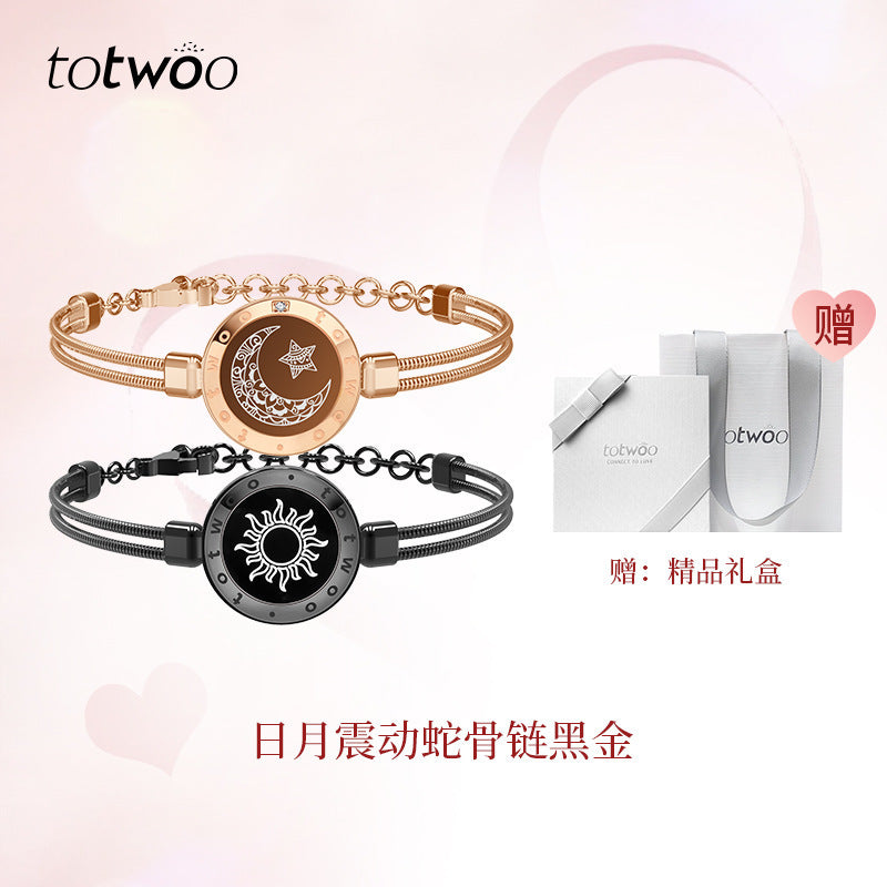 Gold and black smart couple bracelets with round moon-and-star charm discs