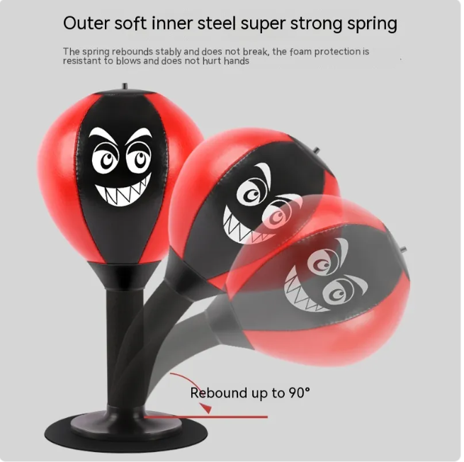 Red and black desktop punching reflex speed ball with cartoon face on black base