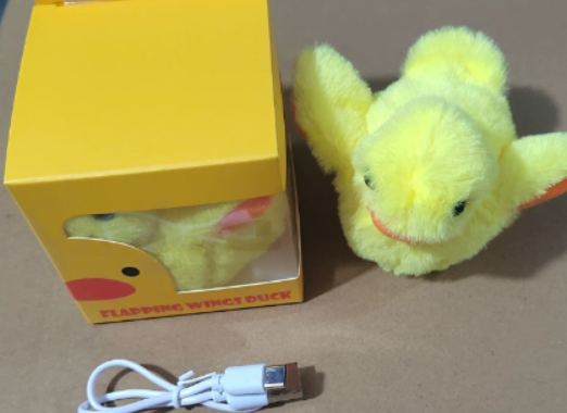 Plush bird cat toy with neon yellow-green fur and small beak, partially out of box