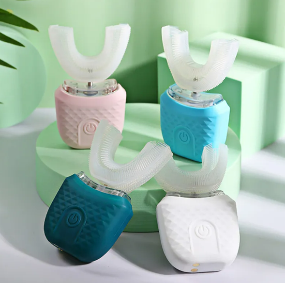 U-shaped ultrasonic toothbrush set with white bristles on pink, blue, teal, and white bases