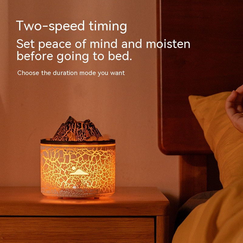 Aroma diffuser with crackled light container and warm glow from the base