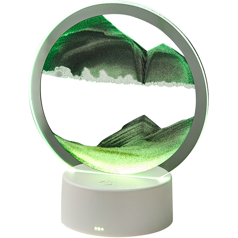Quicksand night lamp with circular glass top, green sand swirl and glowing white base