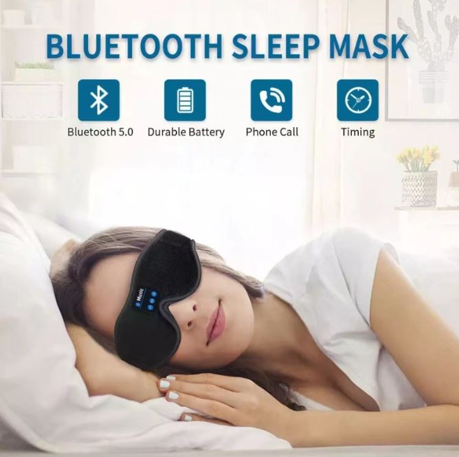 Black Bluetooth sleep eye mask worn on face with control buttons