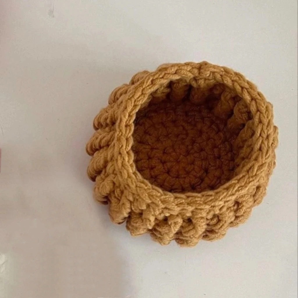 Crochet coaster with ribbed round weave in mustard brown