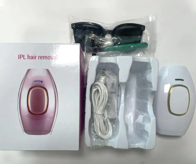 IPL hair removal device kit with rose gold unit, accessory pack, and white handheld