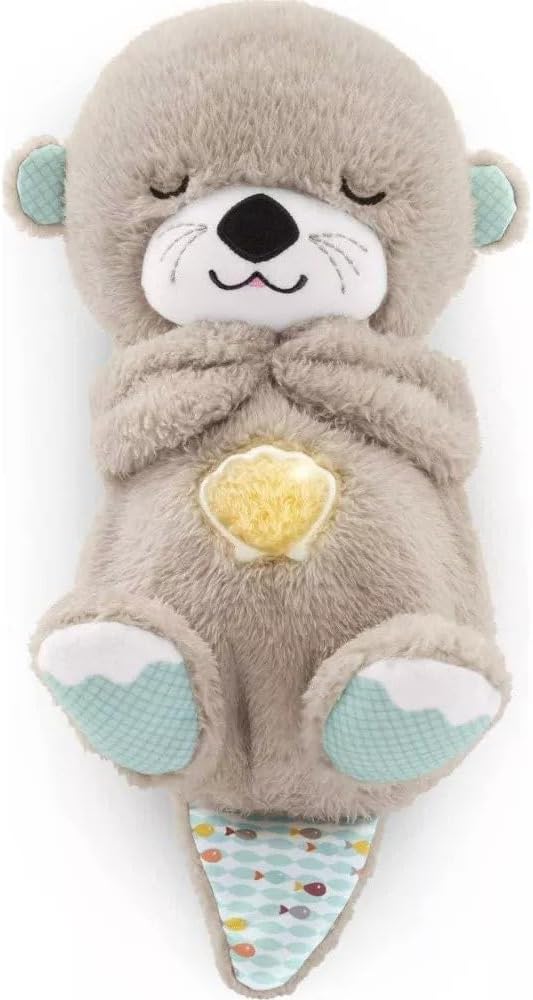 Gray plush seal sound machine with closed eyes and glowing star light in belly